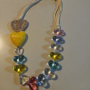 Heart necklace in blue, yellow, & pink, with matching blue heart earrings
